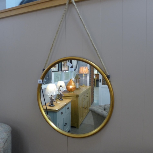 1313 - A large round gold mirror on a hanging rope, 58cm (JRG1114)   #