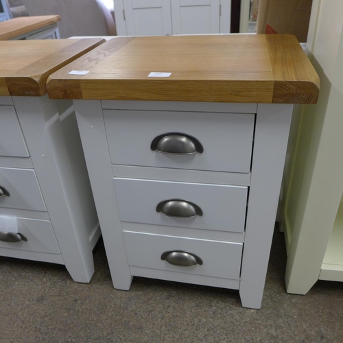 1605 - A Hampshire white painted oak large three drawer bedside table (KEL P03-82)  * This lot is subject t... 