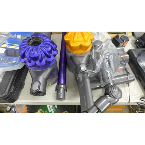 2238 - 2 Dyson handheld vacuum cleaners