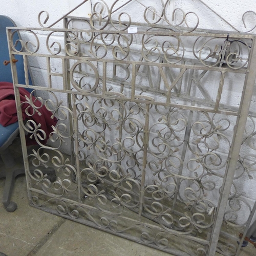 2285 - Pair of scroll design cast metal gates with the words 