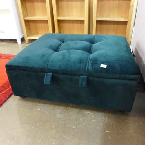 1657 - A dark green upholstered footstool/pull out bed