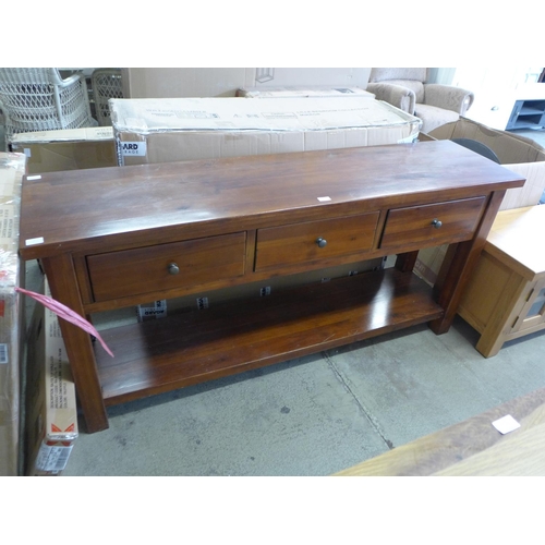 1743 - A stained pine three drawer sideboard