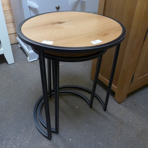 1699 - A Valentino industrial oak round nest of two tables (IA-RN2T)  * This lot is subject to VAT