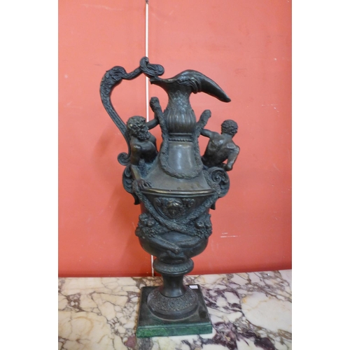 108 - A large Italian Renaissance style bronze ewer, on green marble socle