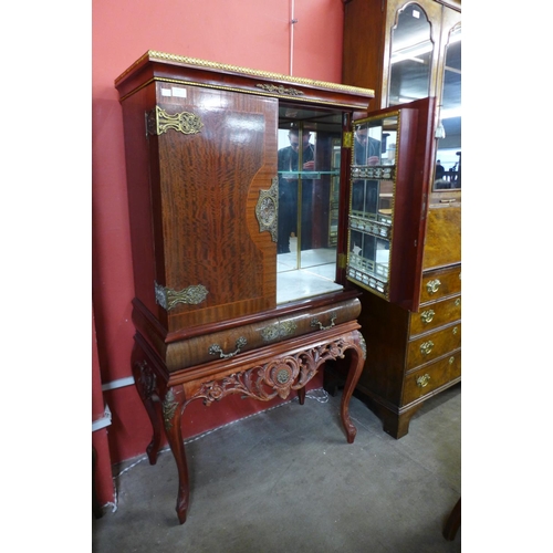 112 - A French mahogany and gilt metal cocktail cabinet