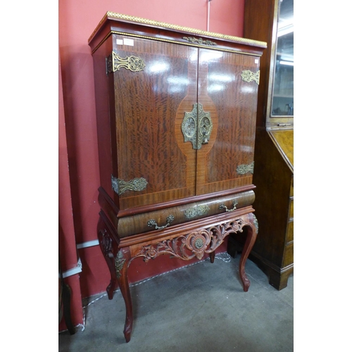 112 - A French mahogany and gilt metal cocktail cabinet