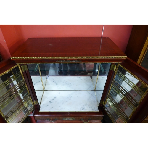 112 - A French mahogany and gilt metal cocktail cabinet