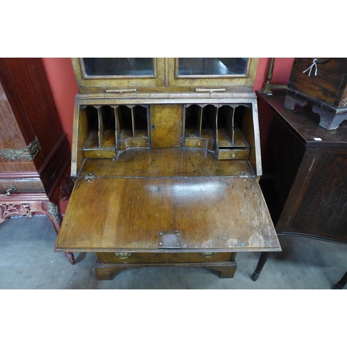 113 - A George I walnut bureau bookcase