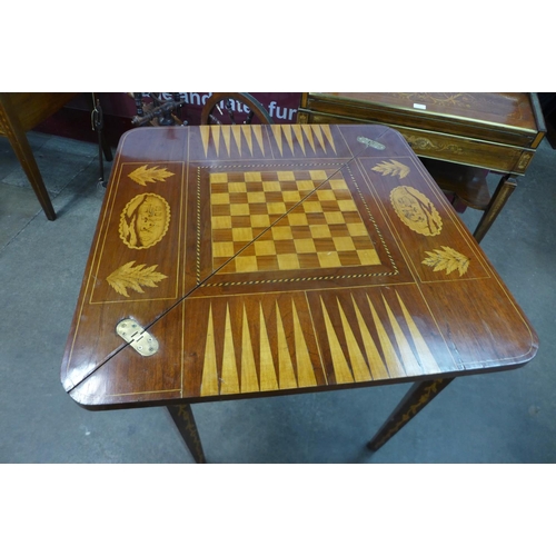 120 - A 19th Century Dutch marquetry inlaid mahogany triangular games table