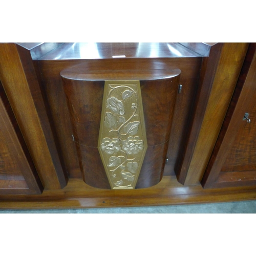 121 - A substantial Art Deco walnut and parcel gilt mirrorback sideboard