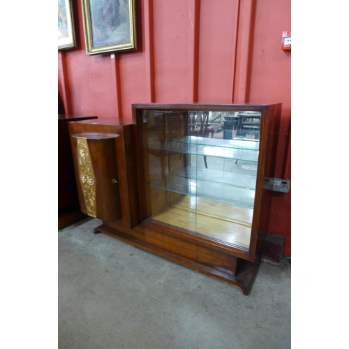 122 - An Art Deco walnut and parcel gilt cocktail cabinet