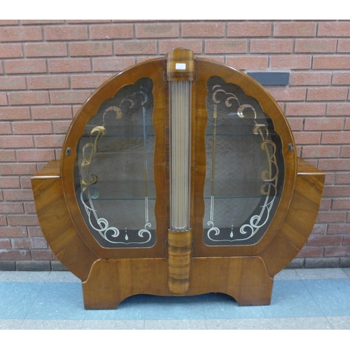 122a - An Art Deco walnut display cabinet