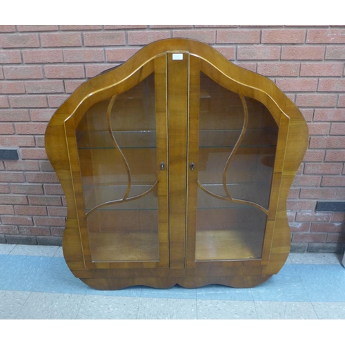 122b - An Art Deco walnut display cabinet