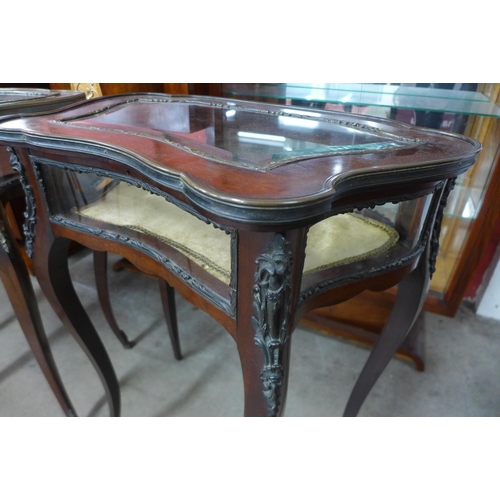 124 - A pair of French Louis XV style mahogany and gilt metal bijouterie tables