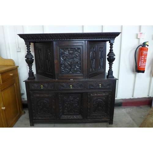 127 - A 17th Century Welsh carved oak cwpard deuddarn