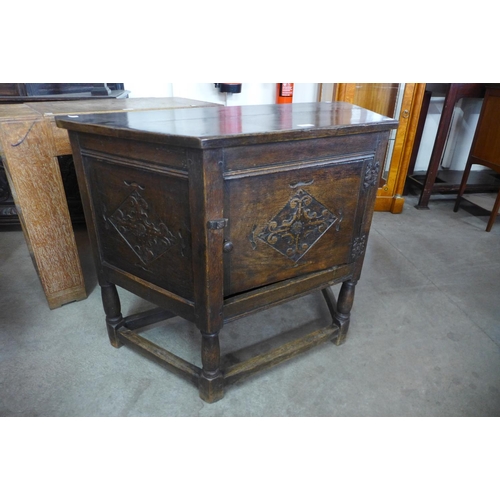 129 - A 17th Century style carved oak credence cupboard