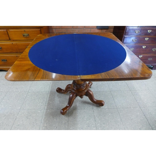 135 - A Victorian walnut fold over card table