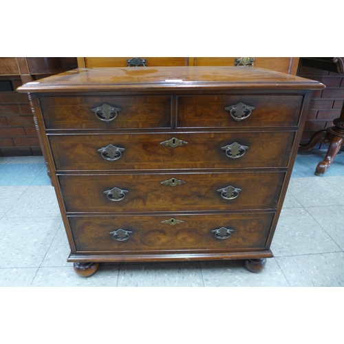 136 - A George II style inlaid burr walnut and mahogany bachelors chest of drawers