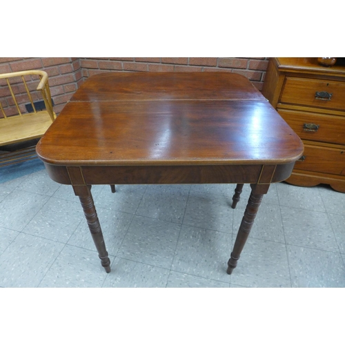 138 - A Victorian mahogany fold over tea table