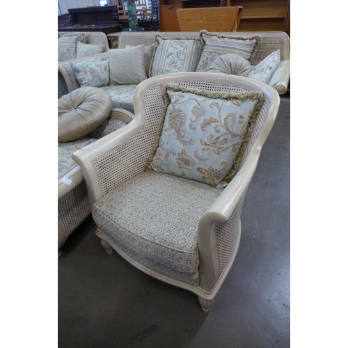 150 - A French style cream bergere four piece suite