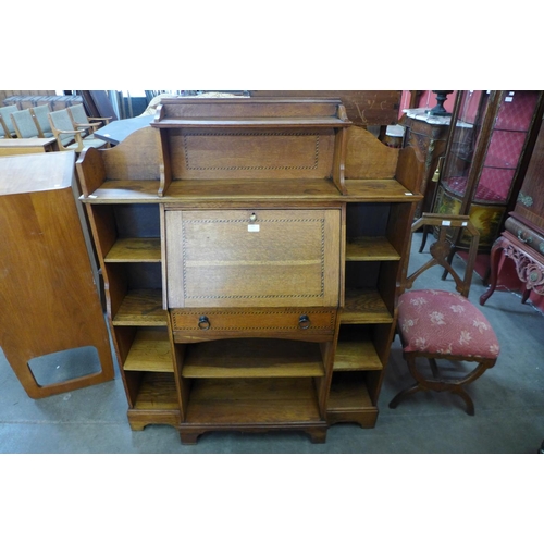 159 - An Arts and Crafts inlaid oak bureau bookcase