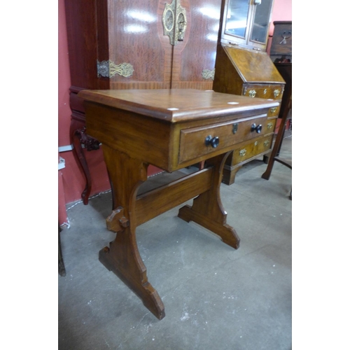 162 - A Victorian Gothic Revival pine and walnut single drawer side table