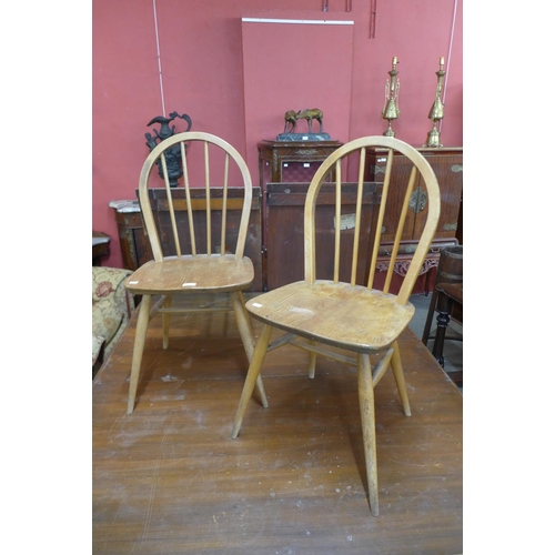 172d - A pair of Ercol Blonde elm and beech Windsor chairs