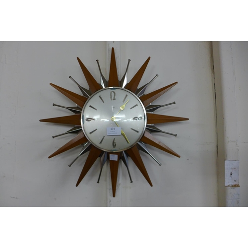 174 - A Metamec sunburst teak  wall clock