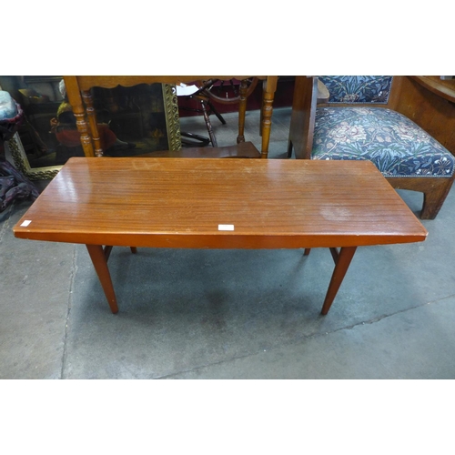 188 - A teak coffee table