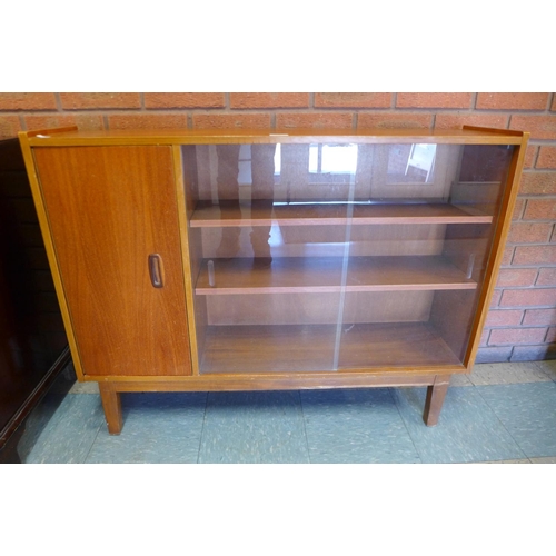 196 - A teak bookcase