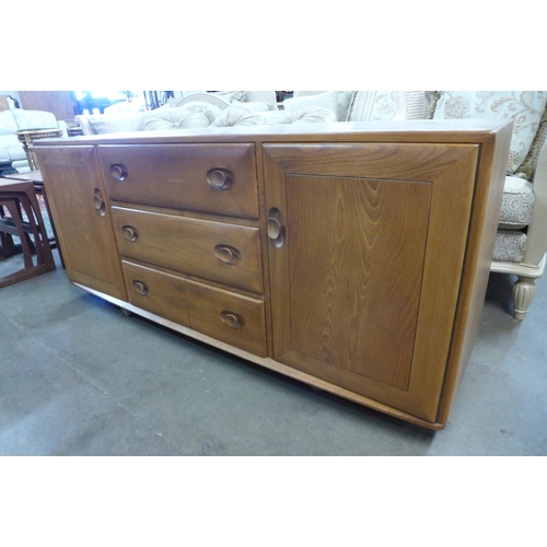 214 - An Ercol Blonde elm Windsor sideboard