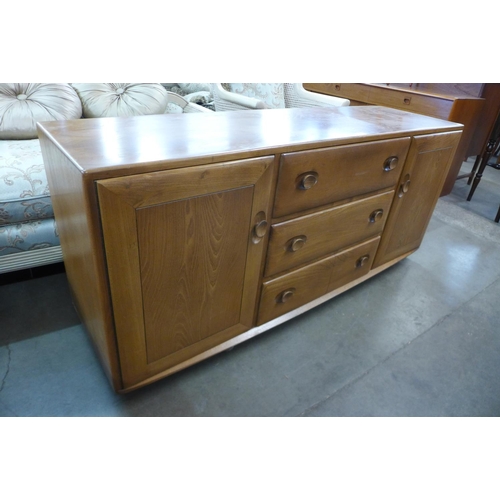 214 - An Ercol Blonde elm Windsor sideboard