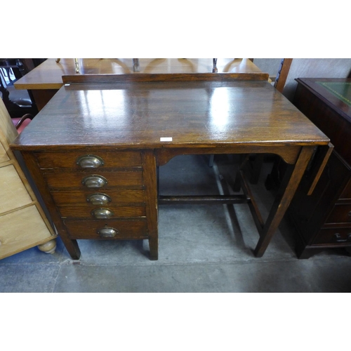 218 - An oak drop-leaf desk