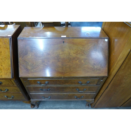 229 - A walnut bureau de dame