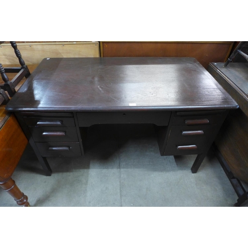 239 - A stained oak desk