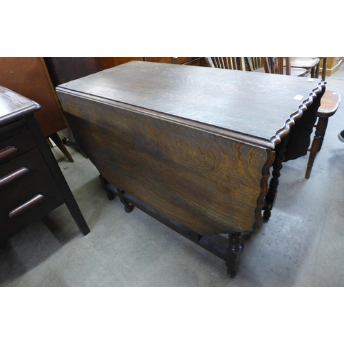 241 - An oak barleytwist gateleg table