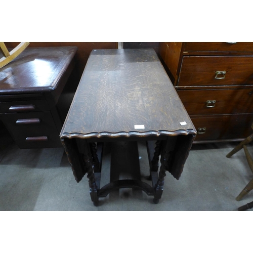 241 - An oak barleytwist gateleg table