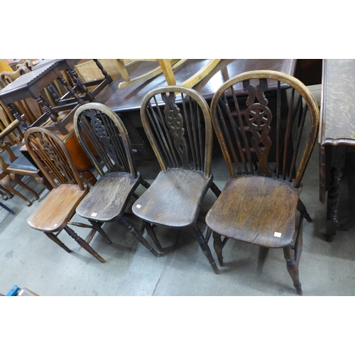 242 - A set of four Victorian elm and beech wheelback Windsor kitchen chairs