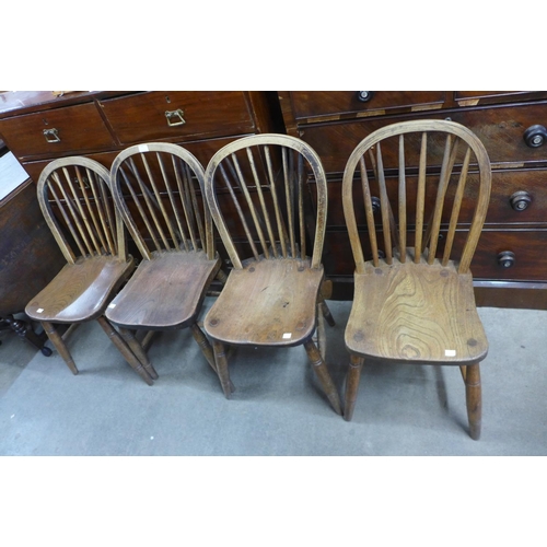 243 - A set of four Victorian elm and beech Windsor kitchen chairs