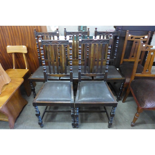 252 - A set of five carved oak chairs