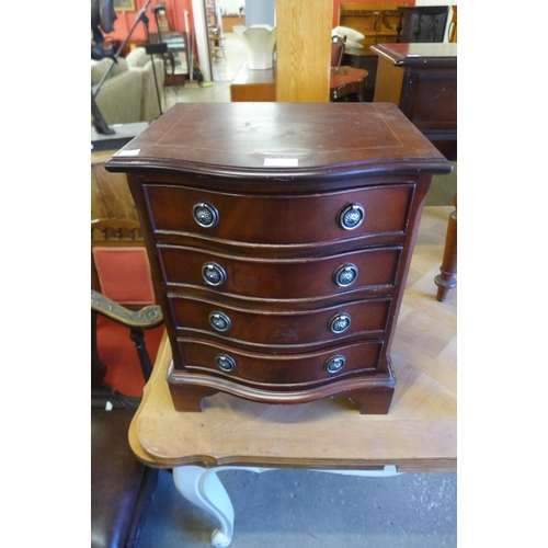 263 - A small mahogany serpentine chest