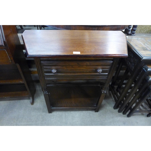 279 - An oak single drawer side table