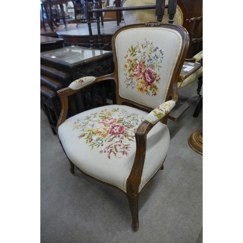 281 - A French beech and fabric upholstered fauteuil