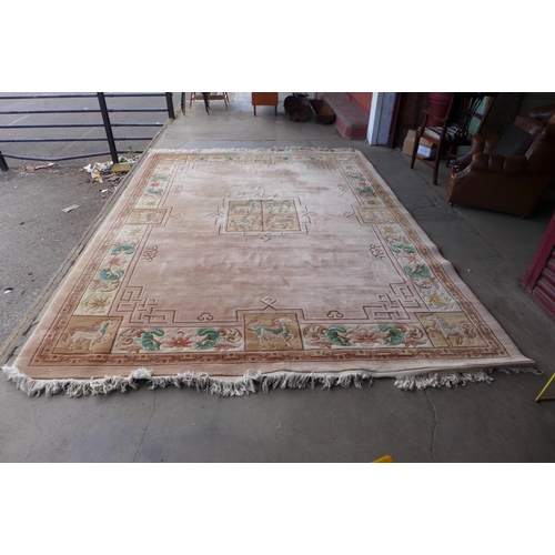 289 - A large Chinese pink ground rug