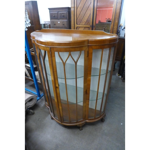 292 - A walnut single door display cabinet