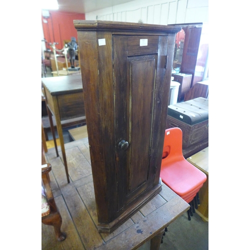 312 - A pine hanging corner cupboard