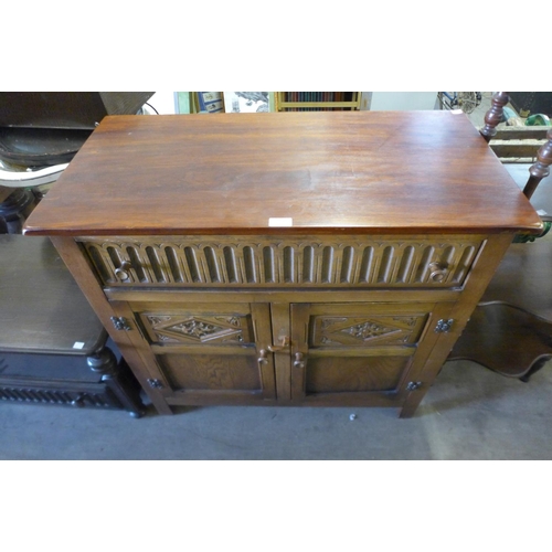 322 - A small carved oak sideboard