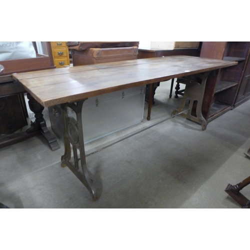 331 - A Trojan cast iron and pine topped table