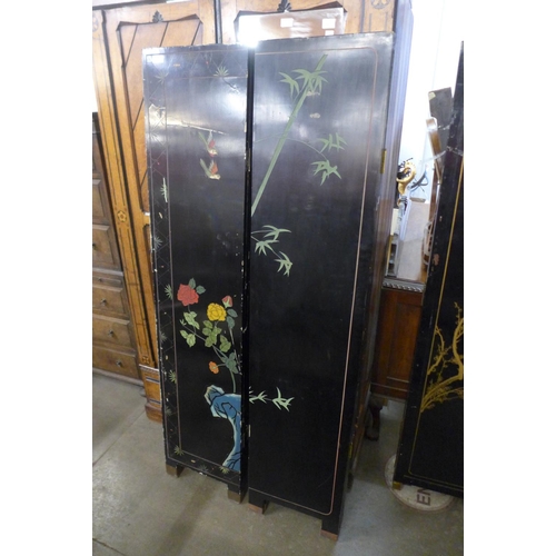 334 - Two Chinese black lacquered chinoiserie folding dressing screens, a/f