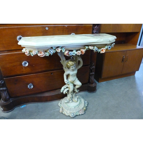 338 - An Italian style plaster cherub console table and mirror